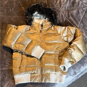 The North Face Gotham Jacket. Shiny Gold Puffer Jacket with Faux Fur Trim.